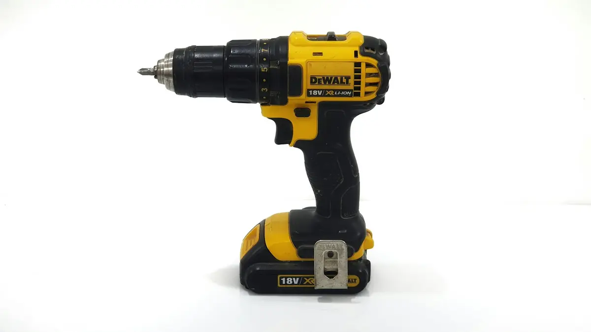 Cordless drill with a black and yellow design and a battery pack.