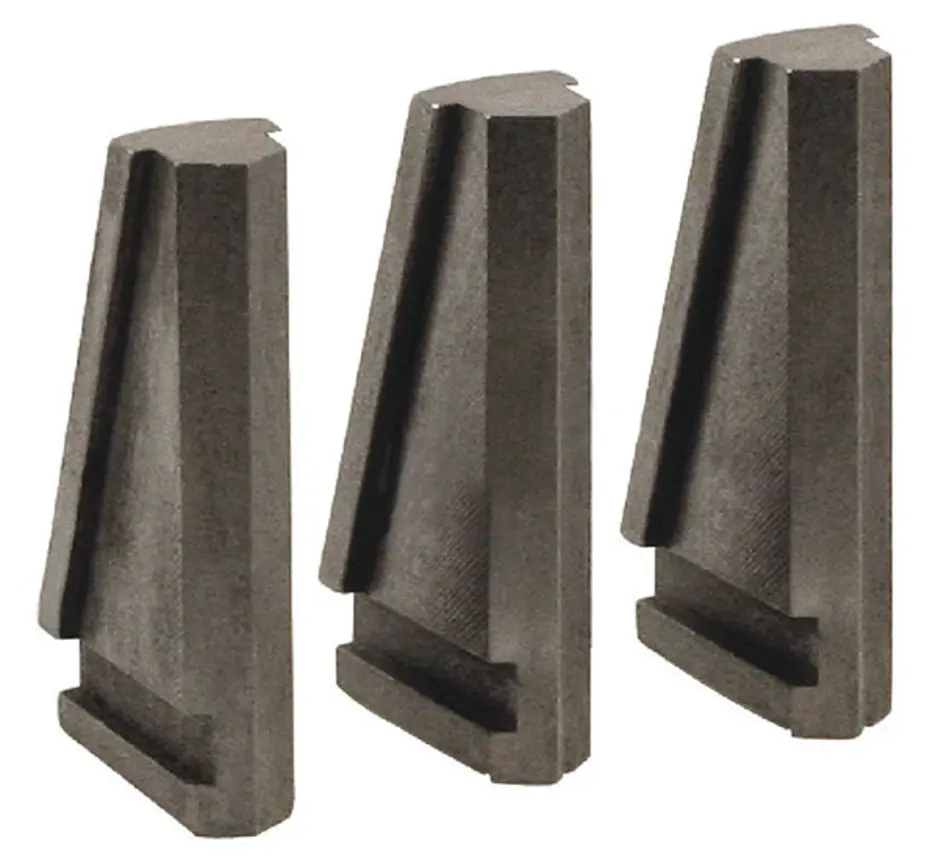 Three drill chuck jaws arranged side by side on a plain background.