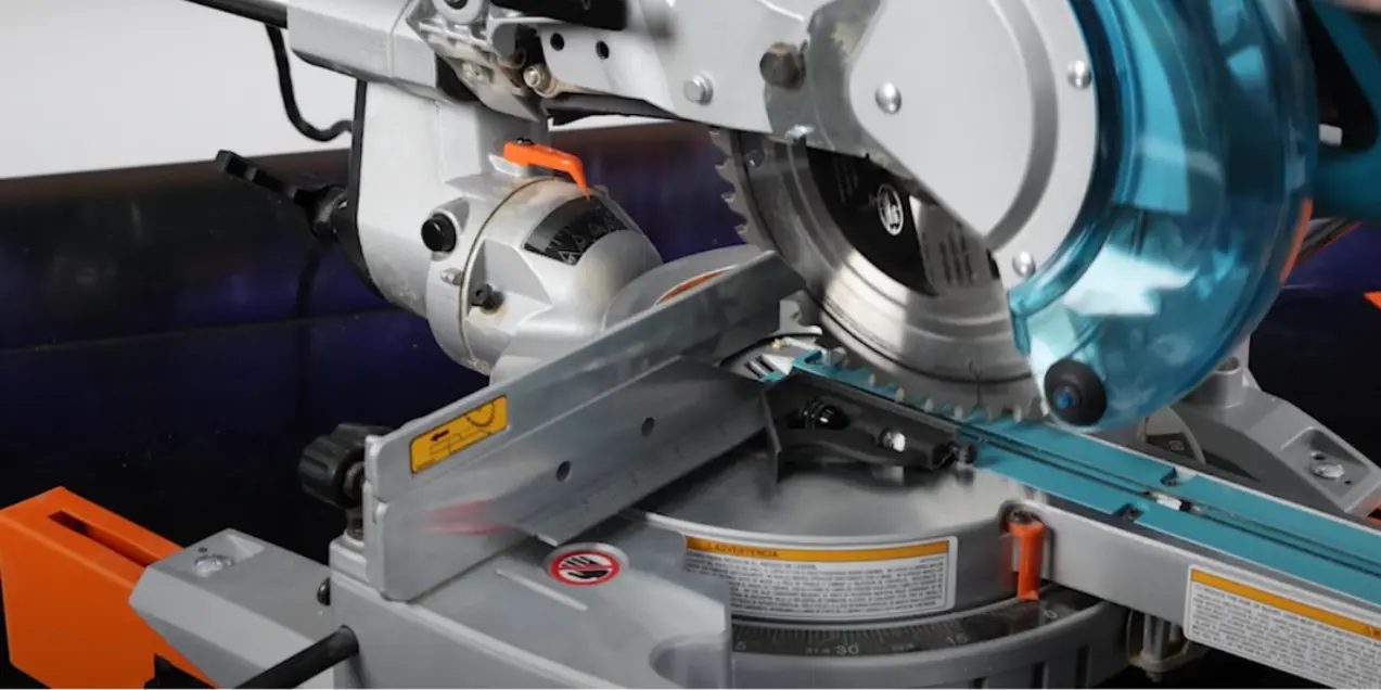 Miter saw showing blade and fence alignment for troubleshooting.